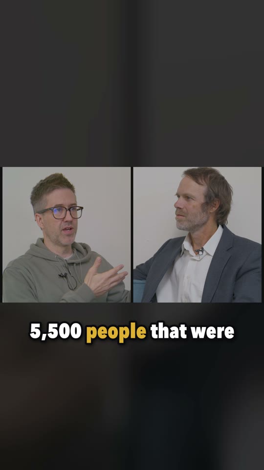 A vertical captioned clip from the same episode, with both hosts in a split frame